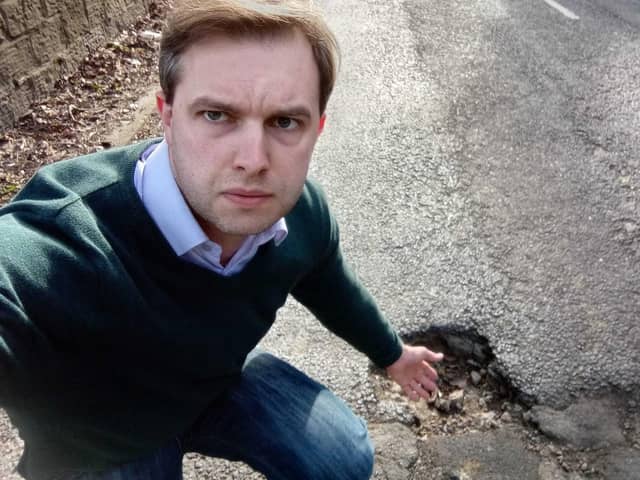 Chris Whitwood with a pothole