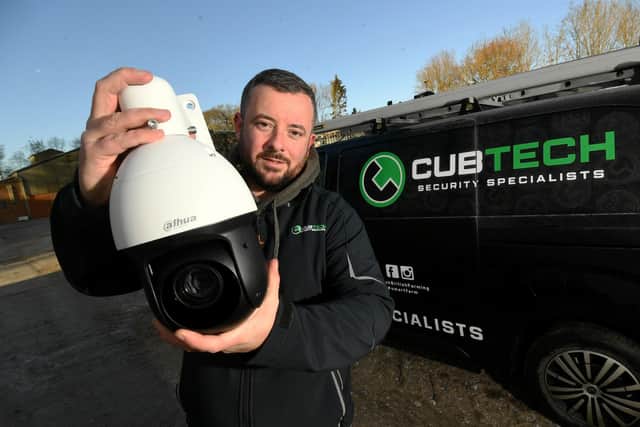 Lee Turner is pictured with a security camera at a farm near Hovingham