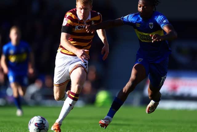 GETTING STUCK IN: Brad Halliday and his Bradford City team-mates showed determination when Wimbledon were the better team