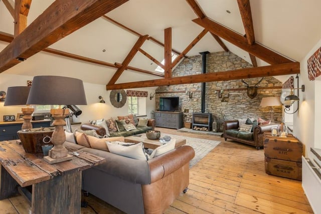 The extra large sitting area with the former granary's original beams and trusses on show.