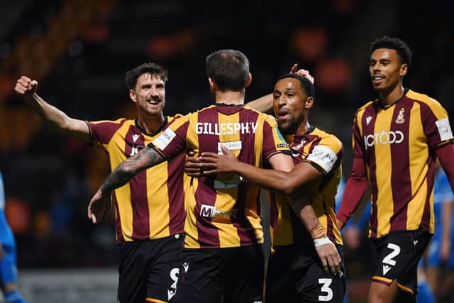 GOAL: Bradford City players celebrate Macaulay Gillesphey's volley (Image: Jonathan Gawthorpe_