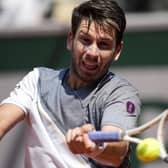 HITTING BACK: Cameron Norrie plays a shot against France's Benoit Paire during their first round match of the French Open at the Roland Garros Picture: AP/Christophe Ena