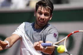 HITTING BACK: Cameron Norrie plays a shot against France's Benoit Paire during their first round match of the French Open at the Roland Garros Picture: AP/Christophe Ena