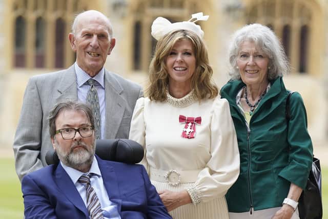 Kate Garraway, with her husband Derek Draper and her parents Gordon and Marilyn Garraway, after being made a Member of the Order of the British Empire for her services to broadcasting, journalism and charity by the Prince of Wales during an investiture ceremony at Windsor Castle, Berkshire. Picture: Andrew Matthews/PA Archive/PA Images.
