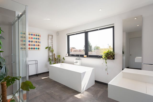 The first floor boasts a large, luxury bathroom complete with free-standing bath tub and shower