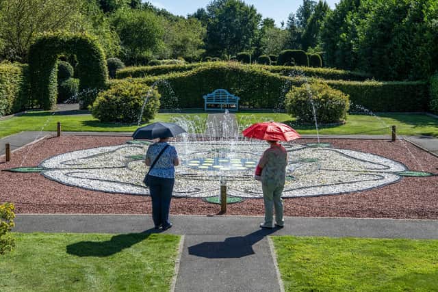 Visitors look at the fountains at Breezy Knees Gardens at Warthill near York
