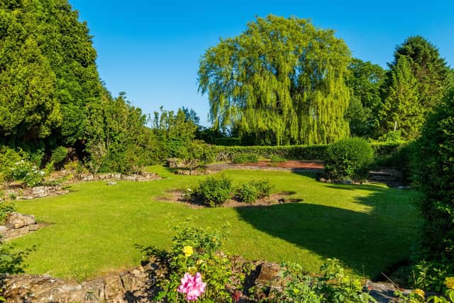 Its 150ft-long garden is south-facing and features herbaceous borders and roses.