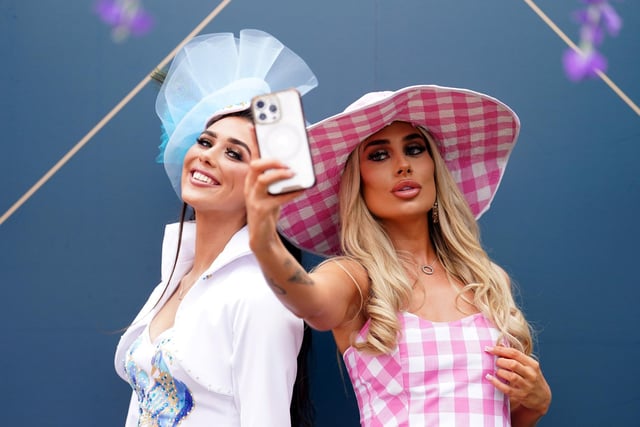 Racegoers Louise Foley and Lizzie Dagnell during day two of the Randox Grand National Festival at Aintree Racecourse, Liverpool. (Photo credit should read: Mike Egerton/PA Wire)