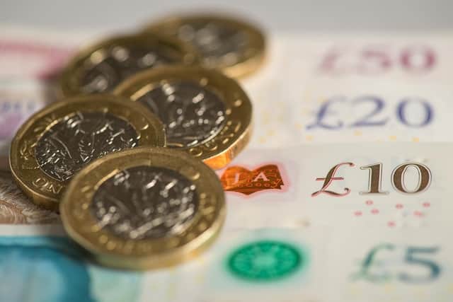 One pound coins and notes. (Pic credit: Dominic Lipinski / PA Wire)