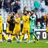 GOING DOWN: Sheffield United players applaud the fans after the final whistle in the Premier League match at St. James' Park, Newcastle upon Tyne. Sheffield United have been relegated from the Premier League after losing 5-1 at Newcastle. Picture: Owen Humphreys/PA