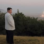 North Korean leader Kim Jong Un inspects a missile test at an undisclosed location in North Korea, as taken sometime between Sept. 25 and Oct. 9, 2022.