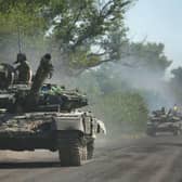 Ukrainian troops move by tanks on a road of the eastern Ukrainian region of Donbas on June 21, 2022. PIC: ANATOLII STEPANOV/AFP via Getty Images