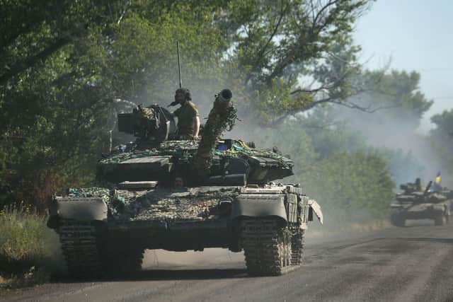 Ukrainian troops move by tanks on a road of the eastern Ukrainian region of Donbas on June 21, 2022. PIC: ANATOLII STEPANOV/AFP via Getty Images