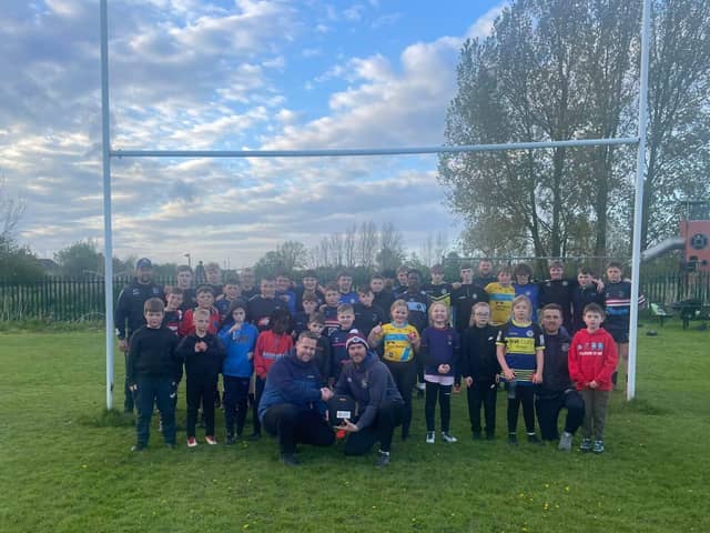 Moorends Marauders RLFC Juniors with the defibrillator gifted by CorrBoard