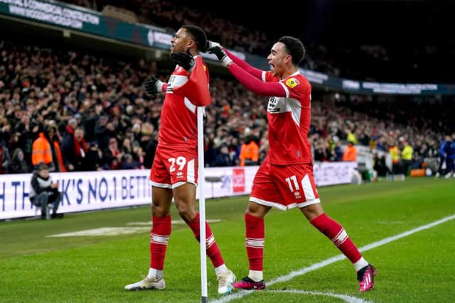 Middlesbrough's Chuba Akpom (left) celebrates scoring their side's first goal of the game during the Sky Bet Championship match at the Riverside Stadium, Middlesbrough. Picture date: Tuesday March 14, 2023. PA Photo. See PA story SOCCER Middlesbrough. Photo credit should read: Owen Humphreys/PA Wire.

RESTRICTIONS: EDITORIAL USE ONLY No use with unauthorised audio, video, data, fixture lists, club/league logos or "live" services. Online in-match use limited to 120 images, no video emulation. No use in betting, games or single club/league/player publications.