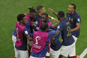 France's forward #12 Randal Kolo Muani (C) celebrates with teammates after he scored his team's second goal during the Qatar 2022 World Cup semi-final football match between France and Morocco (Picture: ODD ANDERSEN/AFP via Getty Images)