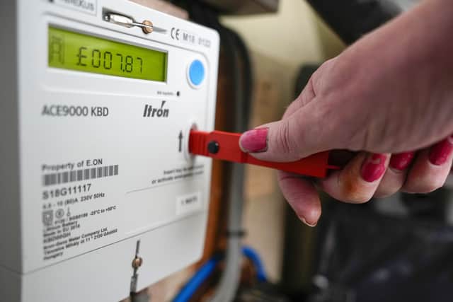 A prepay electricity key sits in a prepayment electricity meter in a rented home. PIC: Christopher Furlong/Getty Images