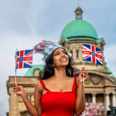 King Charles III Coronations Celebrations in Hull. Pictured Alexandra Thatshaini, aged 30, from Malaysia, now living in Hull, celebrating the King's Coronation in Queen Victoria Square, Hull.