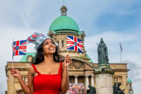 King Charles III Coronations Celebrations in Hull. Pictured Alexandra Thatshaini, aged 30, from Malaysia, now living in Hull, celebrating the King's Coronation in Queen Victoria Square, Hull.