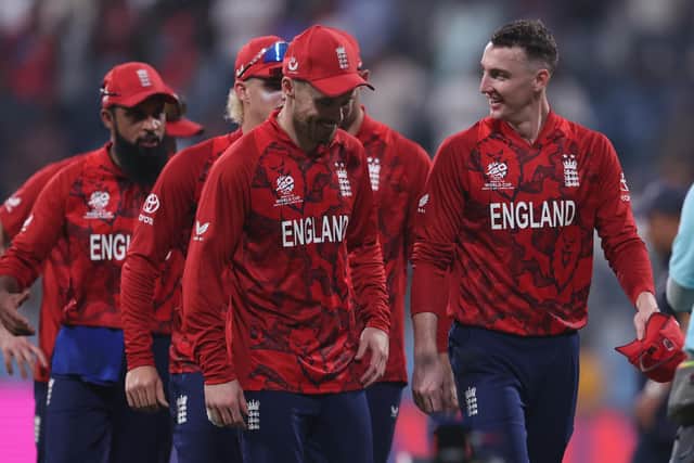 We got there in the end: Harry Brook, right, leads his team off the field after their nail-biting win against Nepal. Photo by Pankaj Nangia/Getty Images