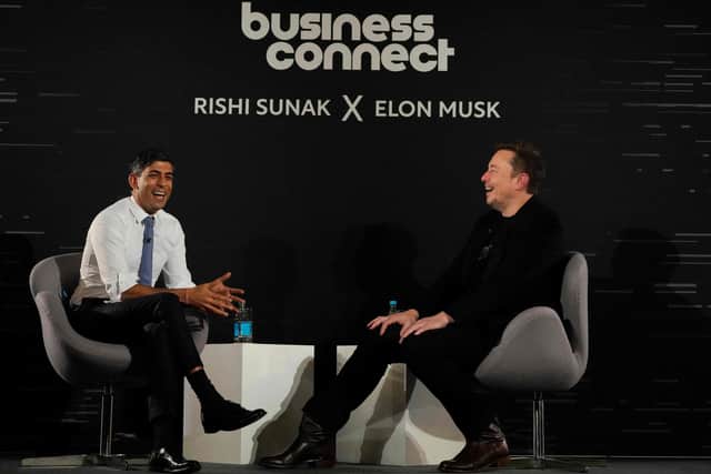 Rishi Sunak, left and Elon Musk on stage after the UK Artificial Intelligence (AI) Safety Summit. Photo by Kirsty Wigglesworth/POOL/ AFP via Getty Images.