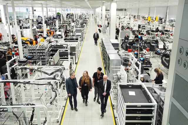 Prime Minister Sir Keir Starmer with (left to right) two apprentices and Work and Pensions Secretary Pat McFadden during a visit to McLaren Automotive last year. PIC: Jonathan Brady/PA Wire