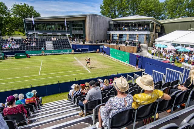 New balls please: Action from one of the courts at Ilkley LT&SC at last year's Ilkley Trophy, with the grandstands on either side, the clubhouse in the background and hospitality to the right. (Picture: Tony Johnson)