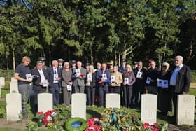Family and military representatives at the  graves of Sheffield RAF hero John Tales and four others who died after the same bomber crashed. Photo: MOD