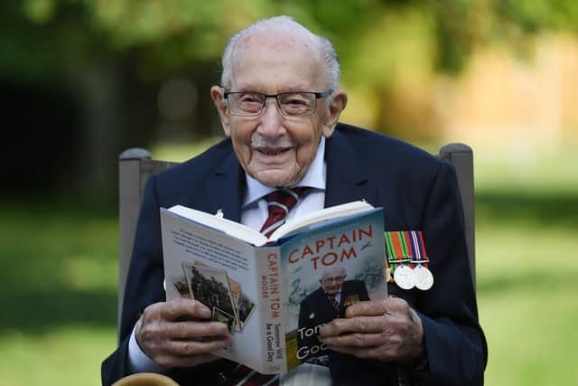 Captain Sir Tom Moore poses for photographers to promote the launch of his book 'Tomorrow is a Good Day' at his home. (Pic credit: Neil Hall / EPA-EFE / Shutterstock)