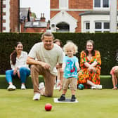 Branching out: A young family tries a new sport at the Bowls' Big Weekend which returns this weekend with 24 clubs inviting people to come and have a go.