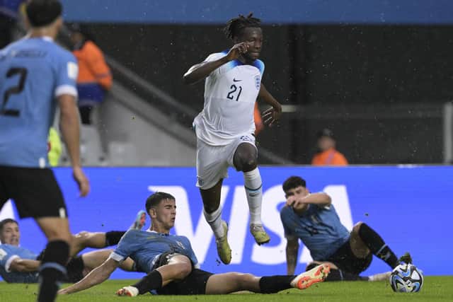 England's defender Daniel Oyegoke (C) figths for the ball with Uruguay's defender Facundo Gonzalez (L) and defender Alan Matturro (R) during the Argentina 2023 U-20 World Cup Group E football match at the Estadio Unico Diego Maradona stadium in La Plata, Buenos Aires in May (Picture: JUAN MABROMATA/AFP via Getty Images)