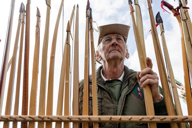 Ian Marr of St George’s Archery Club eyeing up a rack of bows at The Northern Shooting Show