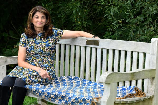 Daxa Patel sat on her father's memorial bench in Golden Acre park in Leeds. PIC: Gary Longbottom