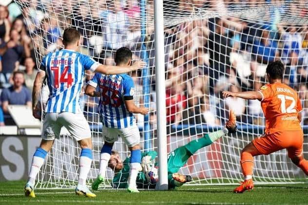 Blackpool goalkeeper Daniel Grimshaw makes a double save to deny Huddersfield Town's Yuta Nakayama a goal during the Sky Bet Championship match at the John Smith's Stadium, Huddersfield. (Picture: Tim Goode/PA Wire)