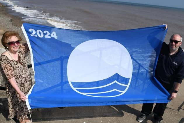 Councillor Barbara Jefferson and Jonathan Newman, council foreshores inspector, proudly display the 2024 Blue Flag for Withernsea. (Pic credit: East Riding of Yorkshire Council)
