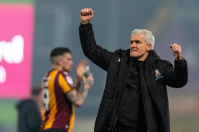 Only looking up: Mark Hughes and his Bradford City team are revelling in the expectation and stalking the top three after a comfortable 3-0 win over Rochdale at Spotland (Picture: Bruce Rollinson)