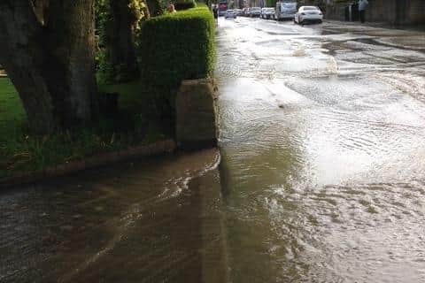 Water pouring down the drive from the 2019 flood