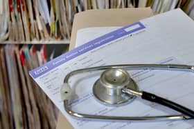 A registration form and a stethoscope at a GP practice. PIC: Anthony Devlin/PA Wire