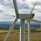 Wind turbines generate electricity on September 21, 2023 in Runcorn, England.