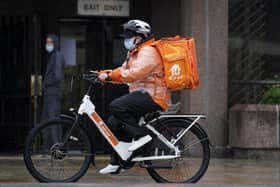 Library image of a Just Eat delivery rider on a bike in Liverpool. (Photo by PA)