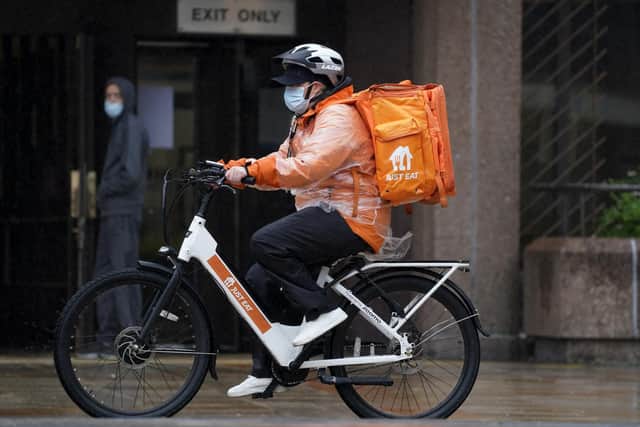 Library image of a Just Eat delivery rider on a bike in Liverpool. (Photo by PA)