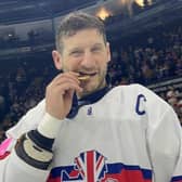 LEGEND: Great Britain ice hockey captain Jonathan Phillips celebrates with his World Championship Division 1 A gold medal. Picture: Dean Woolley.