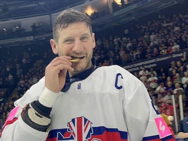 LEGEND: Great Britain ice hockey captain Jonathan Phillips celebrates with his World Championship Division 1 A gold medal. Picture: Dean Woolley.