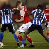 Fleetwood Town's Scott Robertson battles for the ball with Sheffield Wednesday's Dennis Adeniran and Sean Fusire (Picture: Richard Sellers/PA Wire)