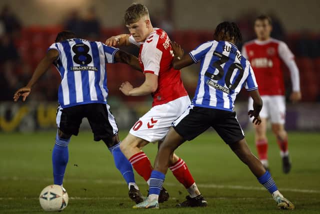 Fleetwood Town's Scott Robertson battles for the ball with Sheffield Wednesday's Dennis Adeniran and Sean Fusire (Picture: Richard Sellers/PA Wire)