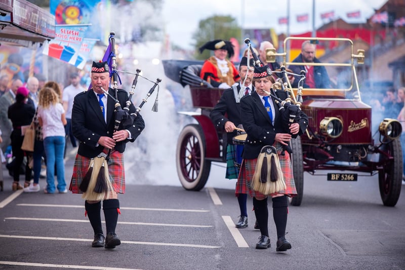 The City of Hull Pipe Band lead the parade to open the Hull Fair.