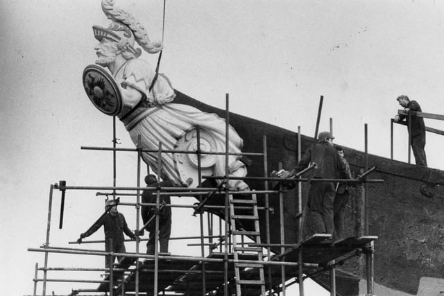 Workmen display their talents as they restore HMS Warrior in 1986.