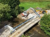 Contractors building a bridge across Skeeby Beck after removing the concrete ford.