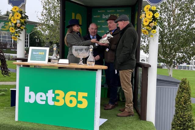 Victory Spoils: Rebecca Davison, granddaughter of the late Charlie Hall, presents winning connections with their prizes at Wetherby.