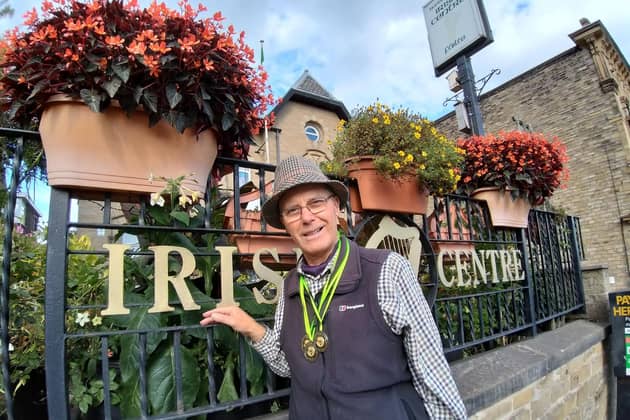 Peter Fawcett in front of begonias, taken by his wife Áine.